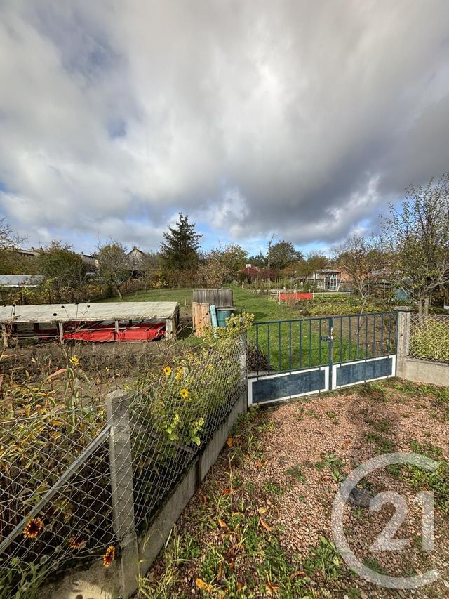 Afficher la photo en grand terrain à vendre - 1161.0 m2 - MONTLUCON - 03 - AUVERGNE - Century 21 Pasquet Immobilier